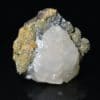 Calcite sur sidérite de Peyrebrune, Tarn. Fluorescente.