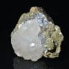 Calcite sur sidérite de Peyrebrune, Tarn. Fluorescente.