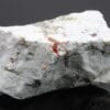 Hatchite, wallisite et réalgar, carrière de Lengenbach, Valais, Suisse.