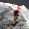Hatchite, wallisite et réalgar, carrière de Lengenbach, Valais, Suisse.