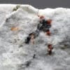Hatchite, wallisite et réalgar, carrière de Lengenbach, Valais, Suisse.