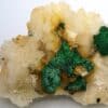 Pseudomorphose de chalcopyrite en malachite sur cristaux de dolomite, Eugui, Espagne.